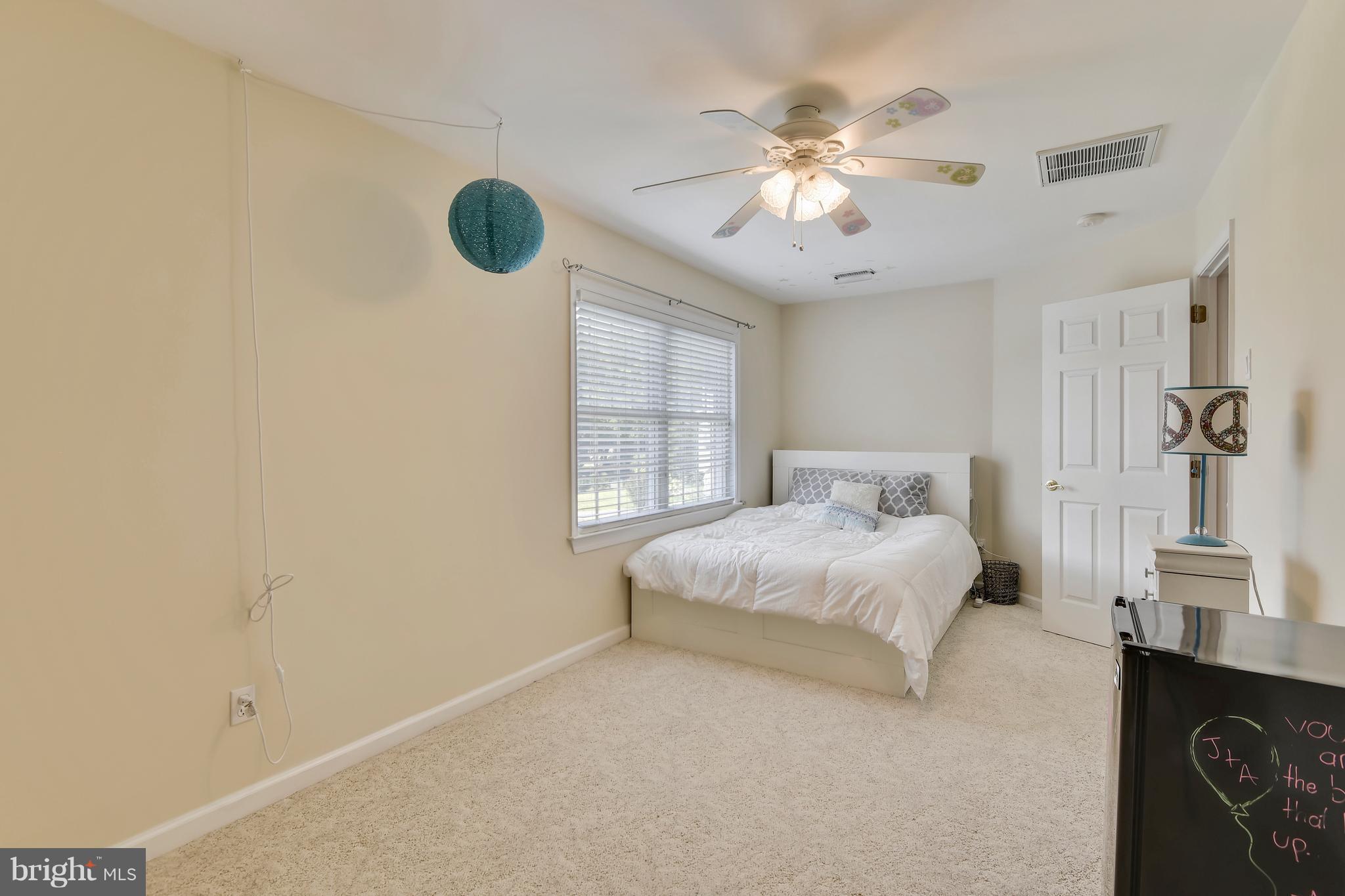 122 Cedar Road Chester, MD 21619 - Photo 20 of 28 a bedroom with a bed and a window