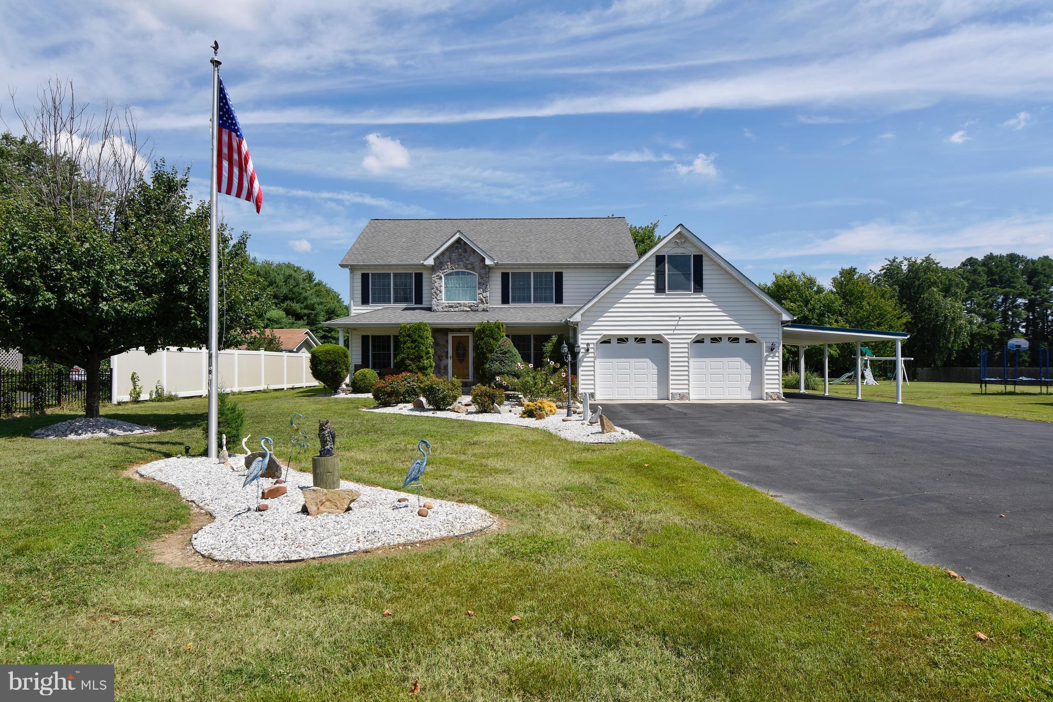 122 Cedar Road Chester, MD 21619 - Photo 3 of 28 a front view of a house with a yard