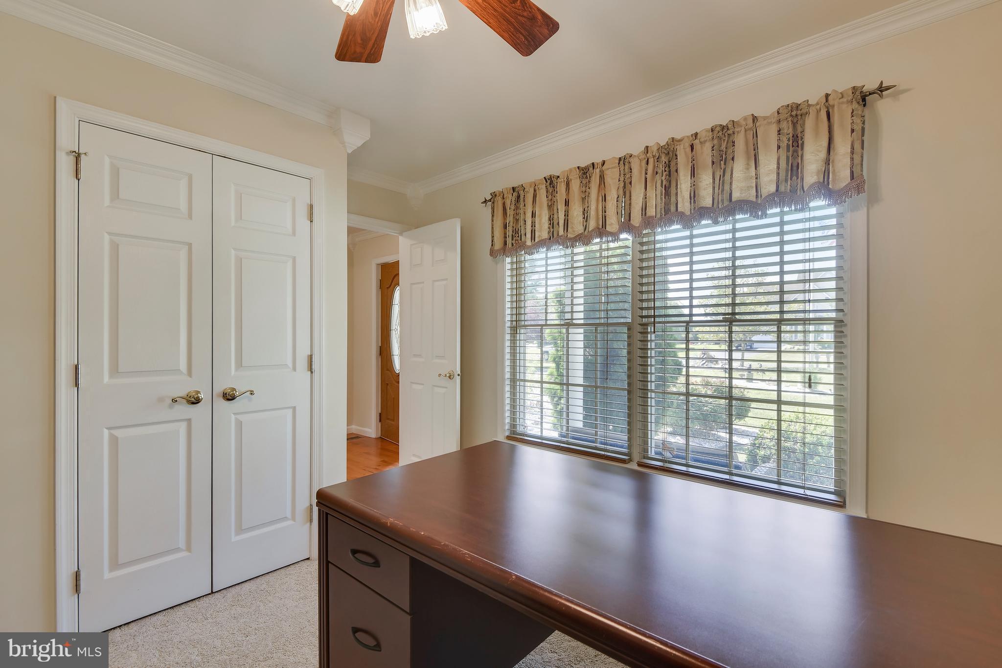 122 Cedar Road Chester, MD 21619 - Photo 24 of 28 a view of an empty room with window and wooden floor