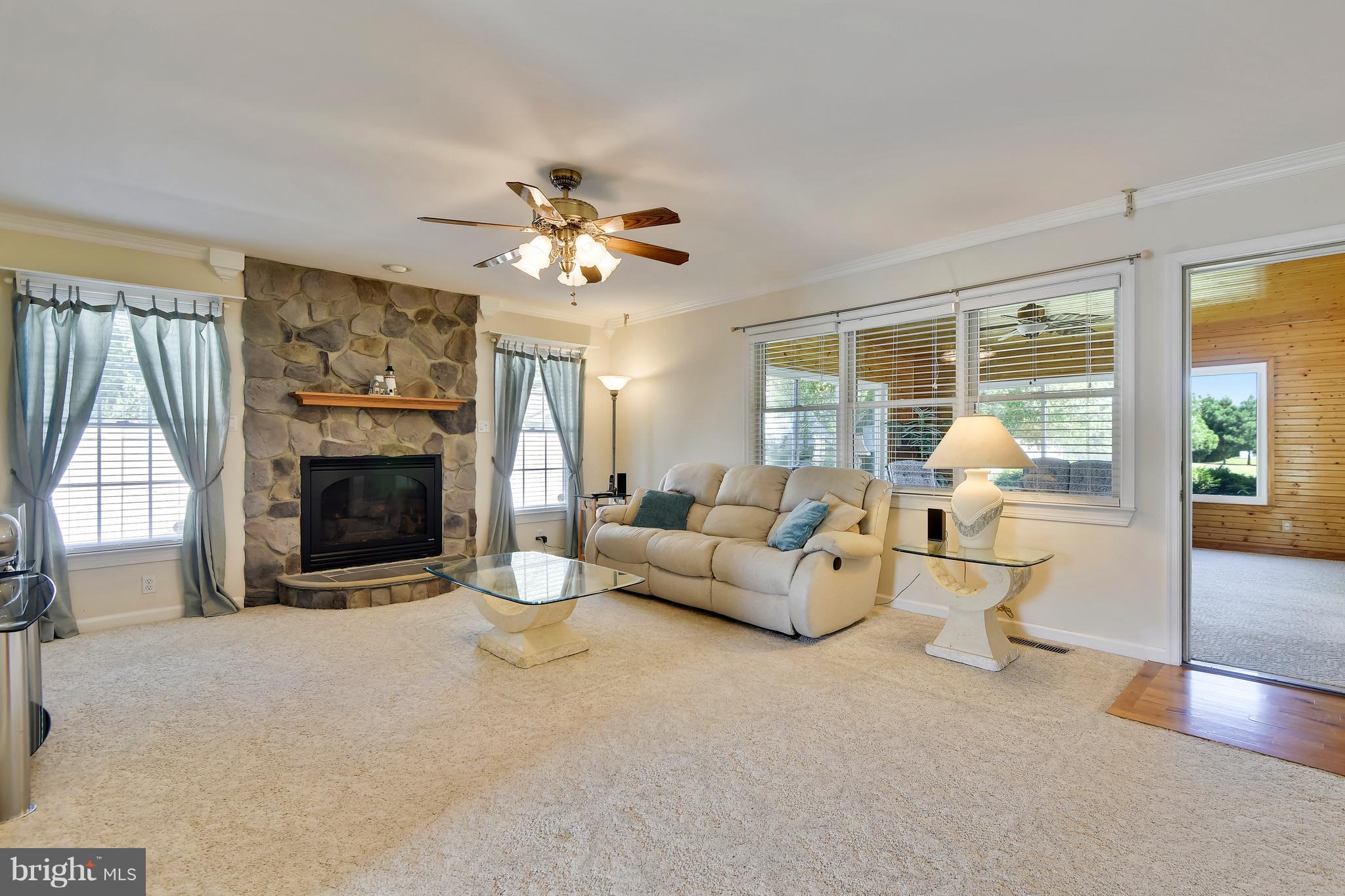 122 Cedar Road Chester, MD 21619 - Photo 7 of 28 a living room with furniture and a fireplace