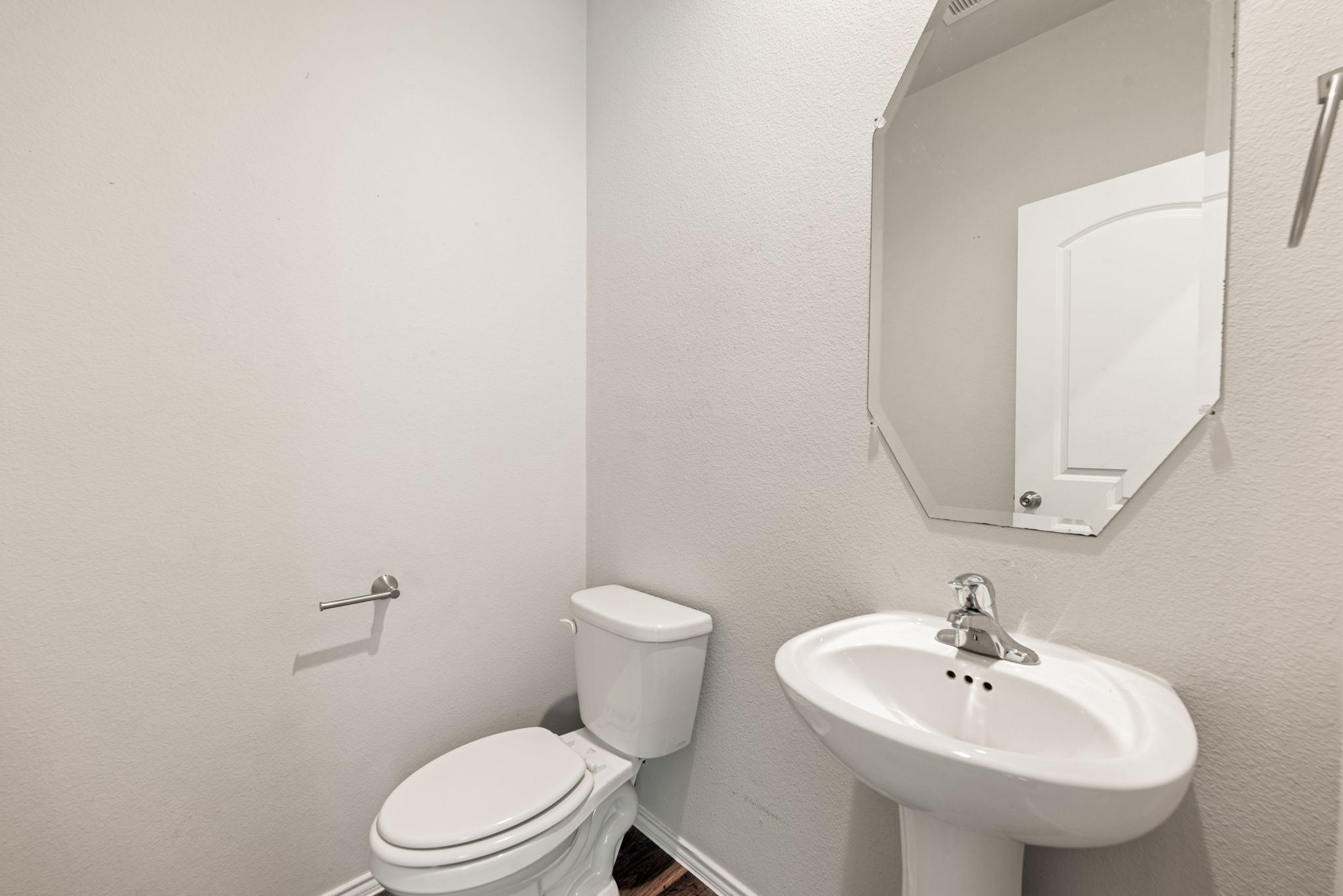 23119 Rivercane Shadow Trail Spring, TX 77373 - Photo 15 of 32 a bathroom with a sink a mirror and a toilet