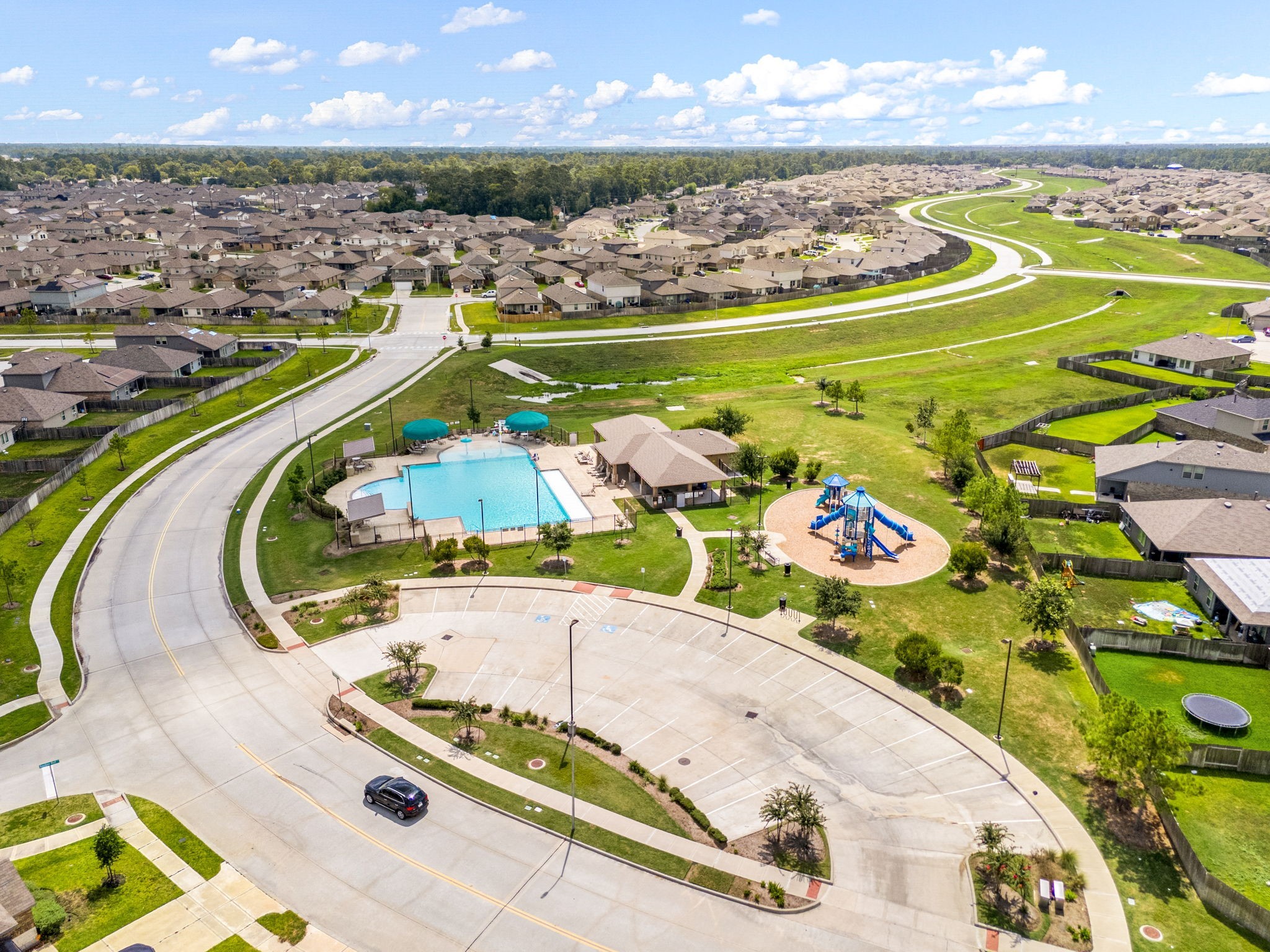 23119 Rivercane Shadow Trail Spring, TX 77373 - Photo 30 of 32 an aerial view of a swimming pool with outdoor seating