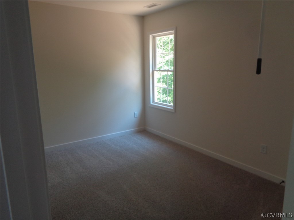 7112 Oakfork Loop New Kent, VA 23124 - Photo 15 of 21 a view of an empty room with a window