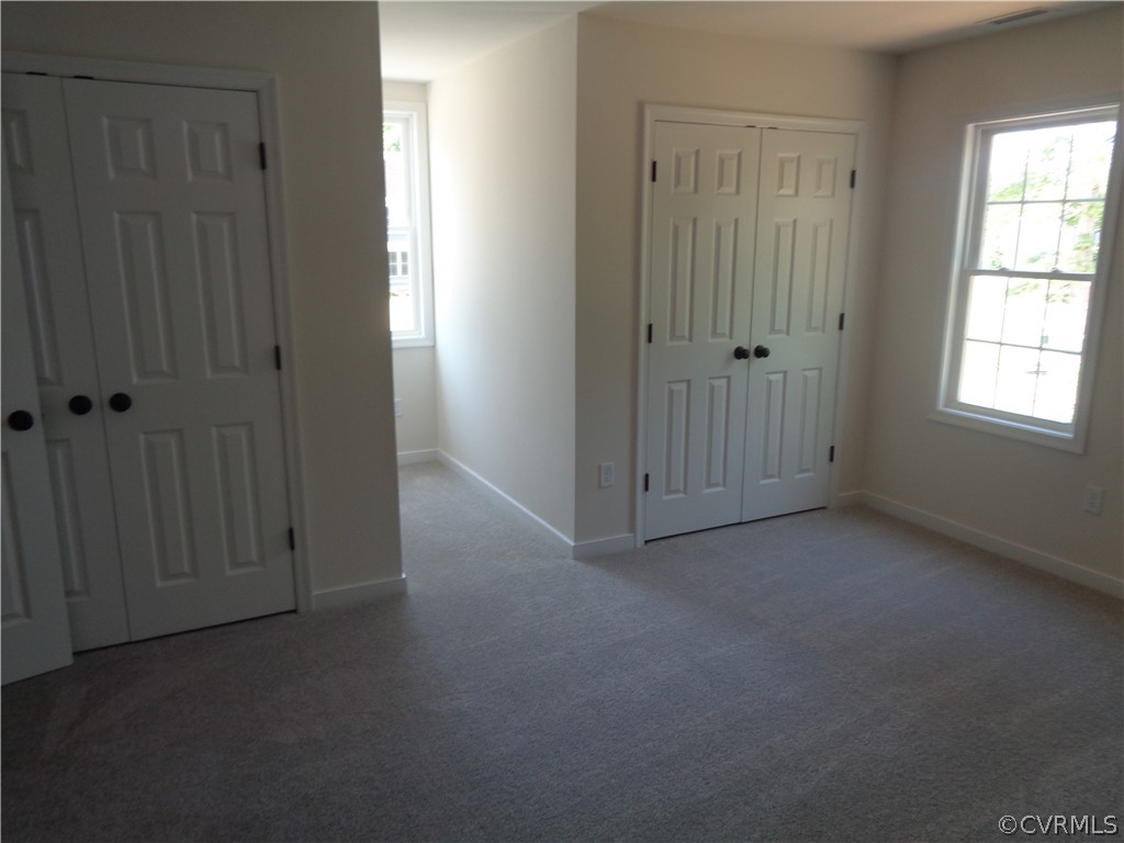 7112 Oakfork Loop New Kent, VA 23124 - Photo 18 of 21 an empty room with windows and closet