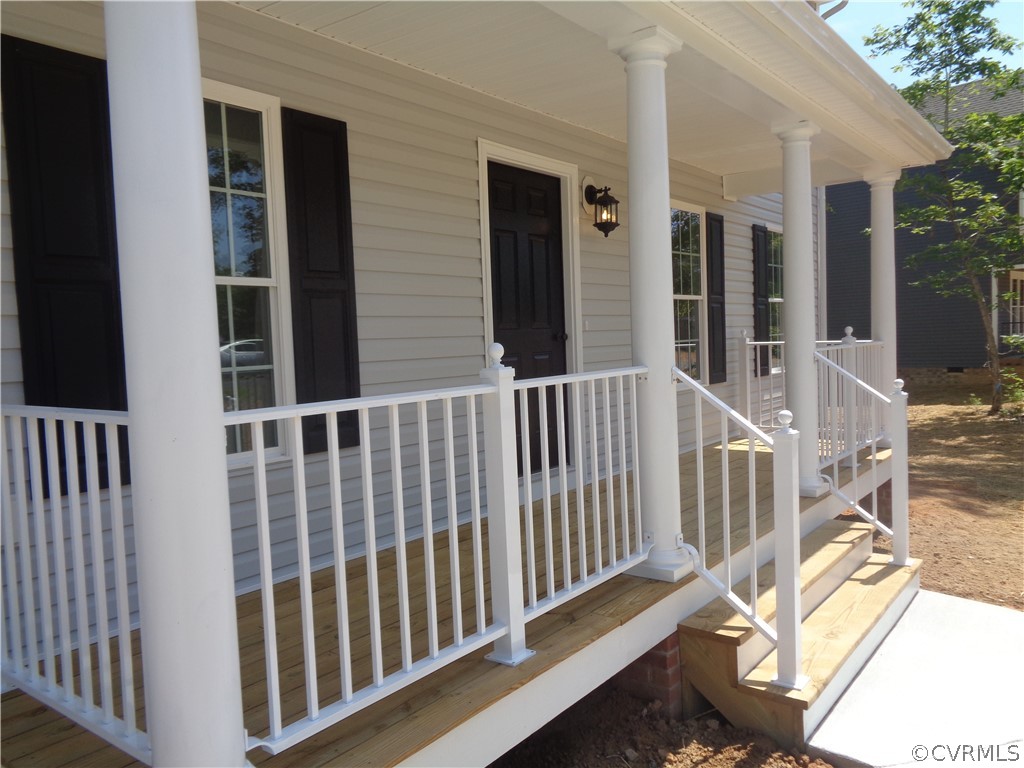 7112 Oakfork Loop New Kent, VA 23124 - Photo 2 of 21 a view of a balcony with wooden floor