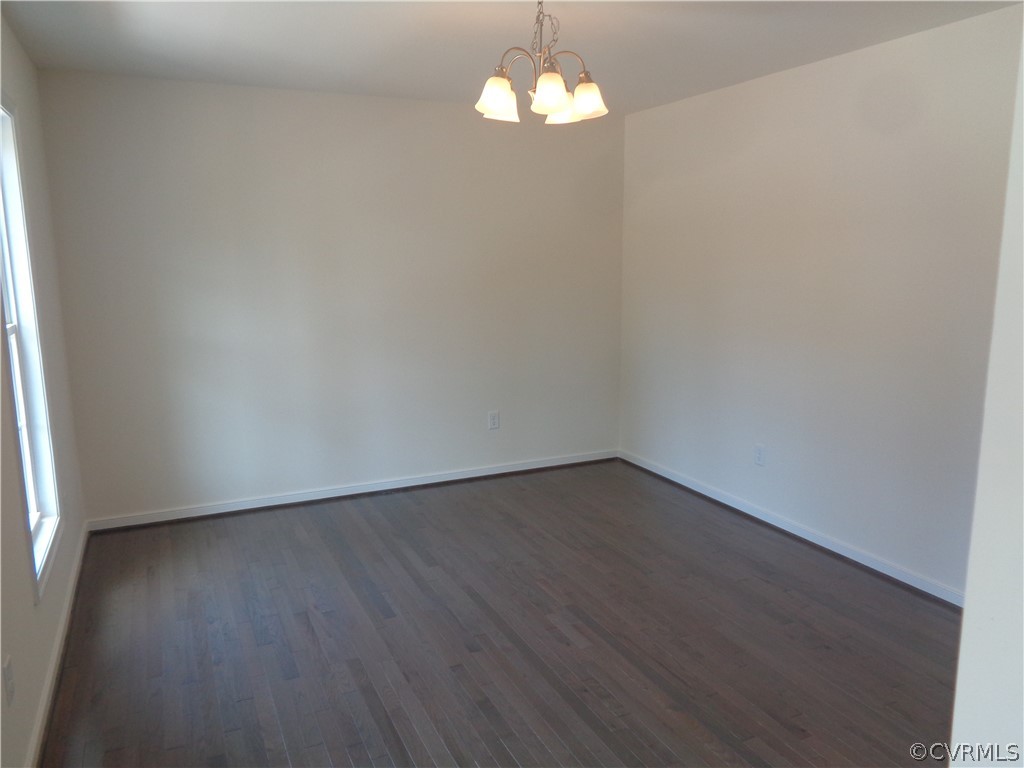 7112 Oakfork Loop New Kent, VA 23124 - Photo 3 of 21 a view of an empty room with wooden floor and a window