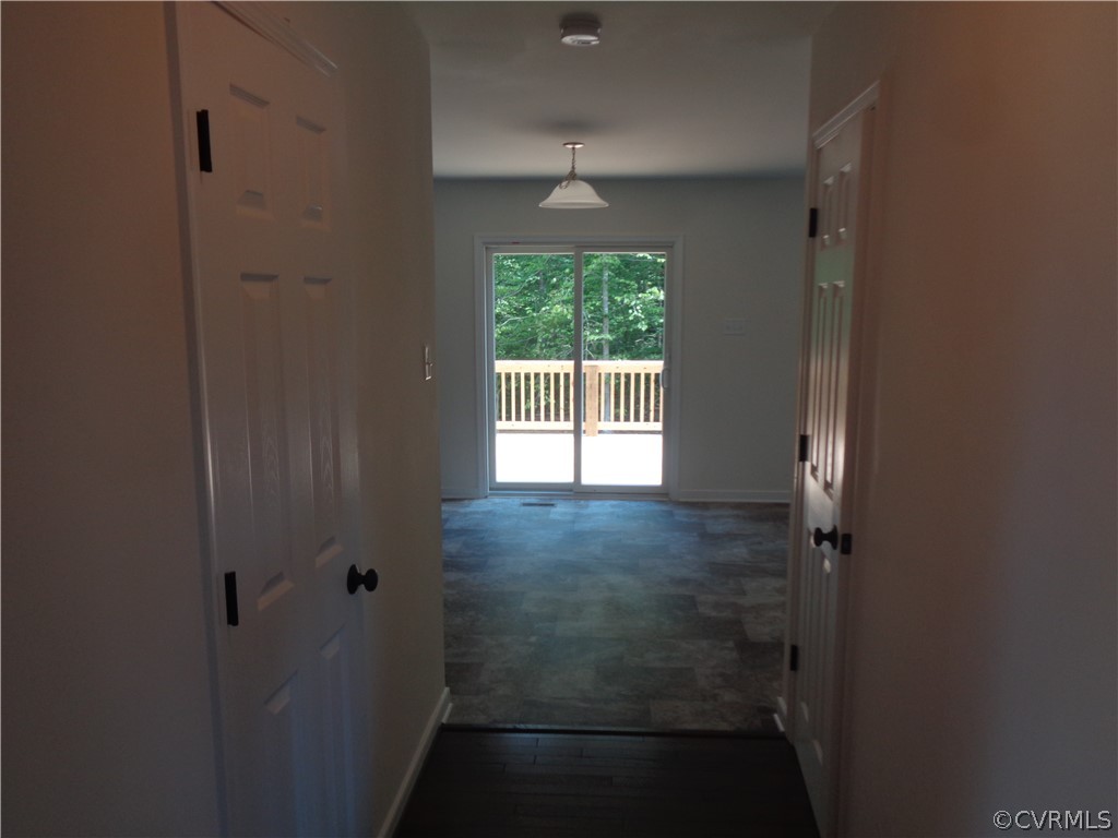 7112 Oakfork Loop New Kent, VA 23124 - Photo 4 of 21 wooden floor in an empty room with a window