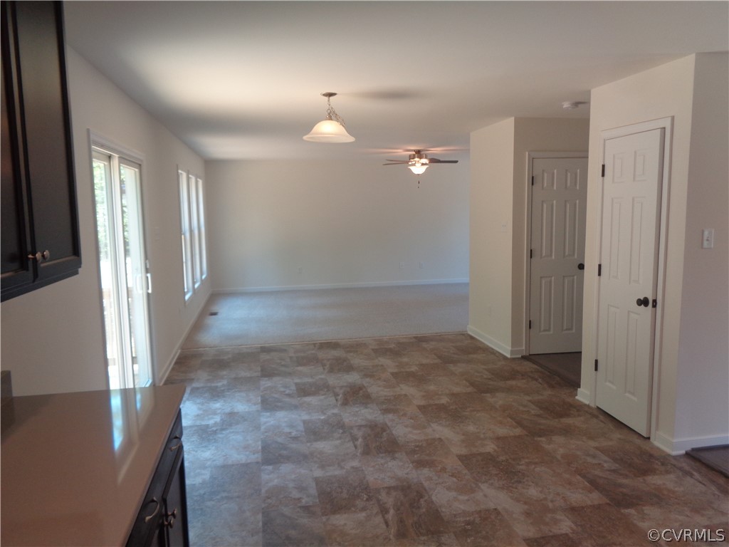 7112 Oakfork Loop New Kent, VA 23124 - Photo 7 of 21 an empty room with windows and entrance