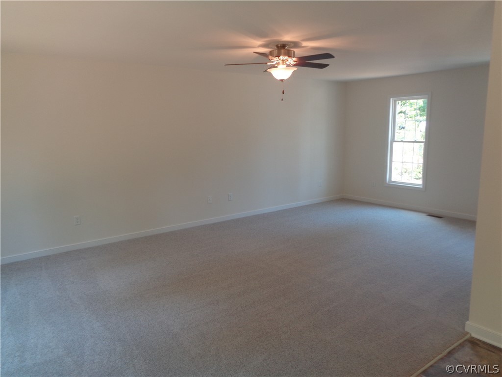 7112 Oakfork Loop New Kent, VA 23124 - Photo 8 of 21 wooden floor in an empty room with a window