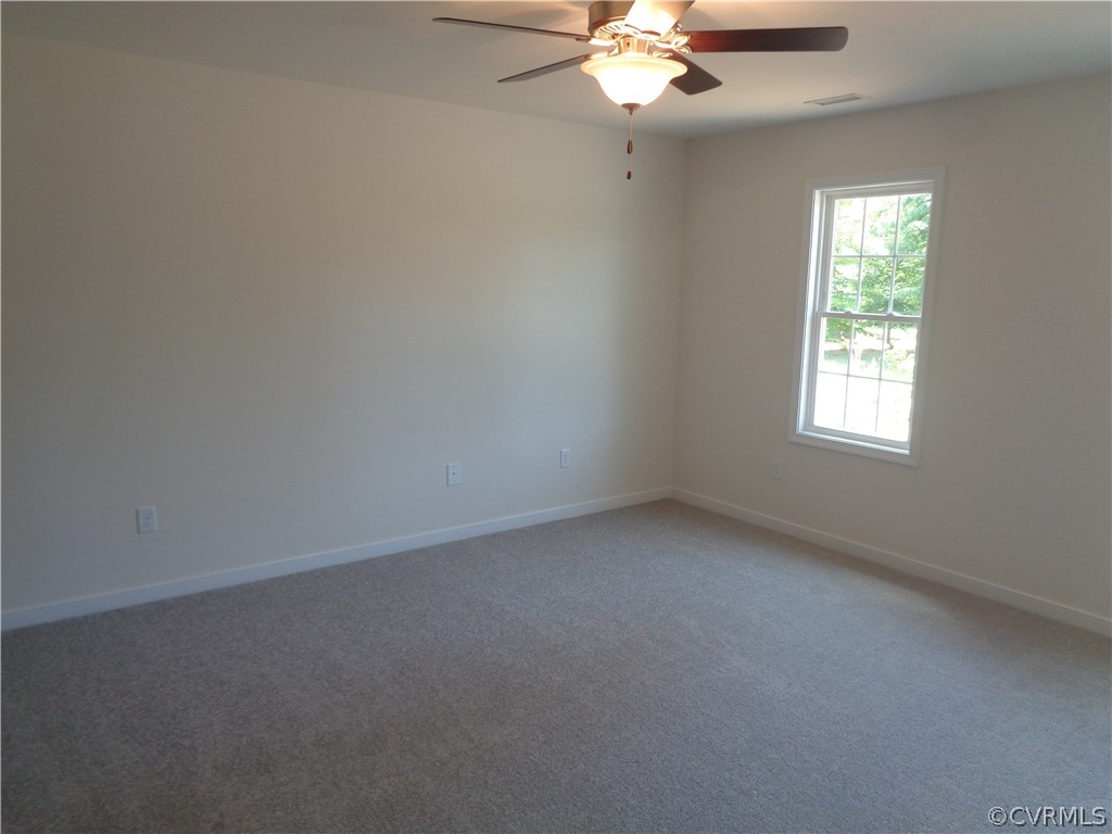 7112 Oakfork Loop New Kent, VA 23124 - Photo 9 of 21 an empty room with a window