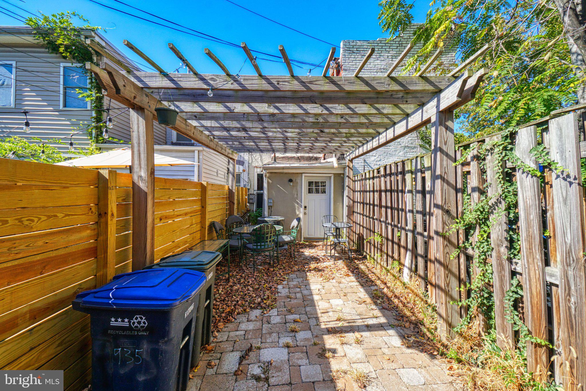 935 8th Street Northeast Washington, DC 20002 - Photo 12 of 19 Charming alleyway with pergola shade.