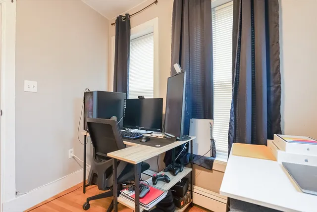 a workspace with furniture and window