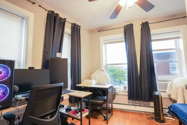 a view of a dining room with furniture and a window