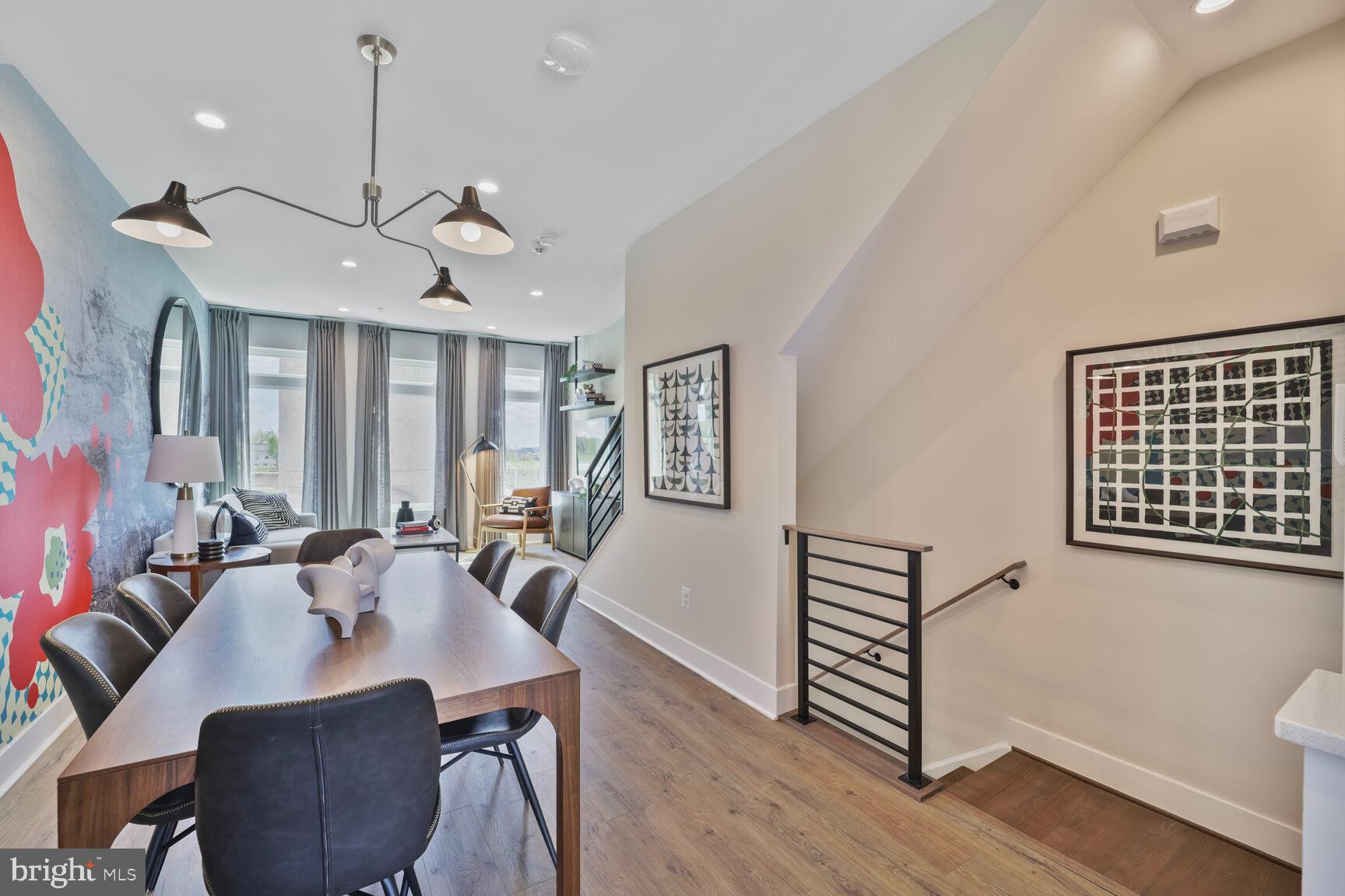 61 Lower Service Road Northwest, Unit ATWOOD 884 Washington, DC 20422 - Photo 5 of 21 a view of a a dining room with furniture window and wooden floor