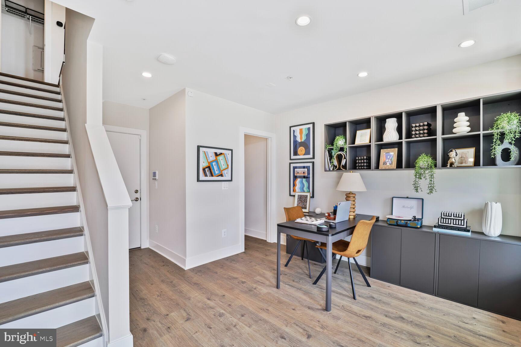 61 Lower Service Road Northwest, Unit ATWOOD 884 Washington, DC 20422 - Photo 6 of 21 a workspace with furniture and stairs
