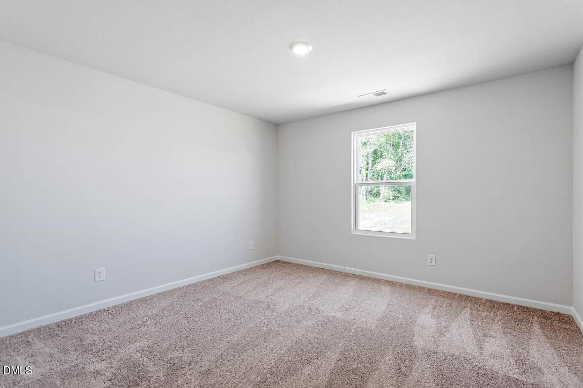 60 Coleshill Road Angier, NC 27501 - Photo 6 of 11 an empty room with windows