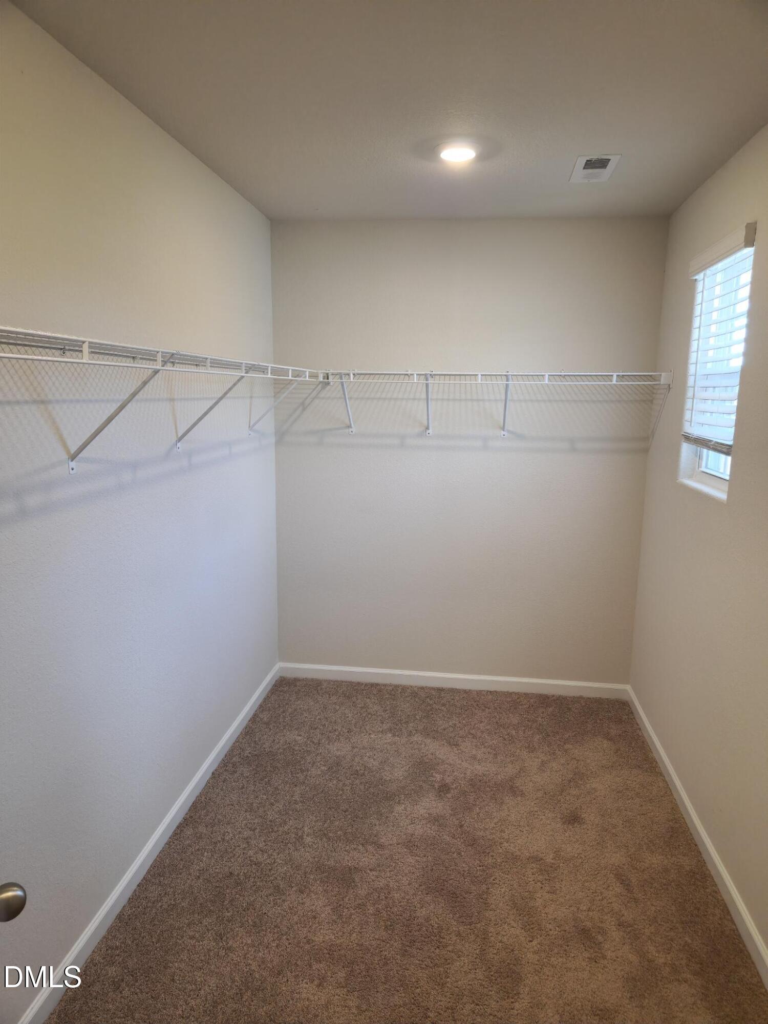 60 Coleshill Road Angier, NC 27501 - Photo 10 of 11 an empty room with a empty space and windows