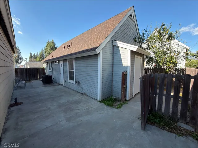 a view of a house with a tree