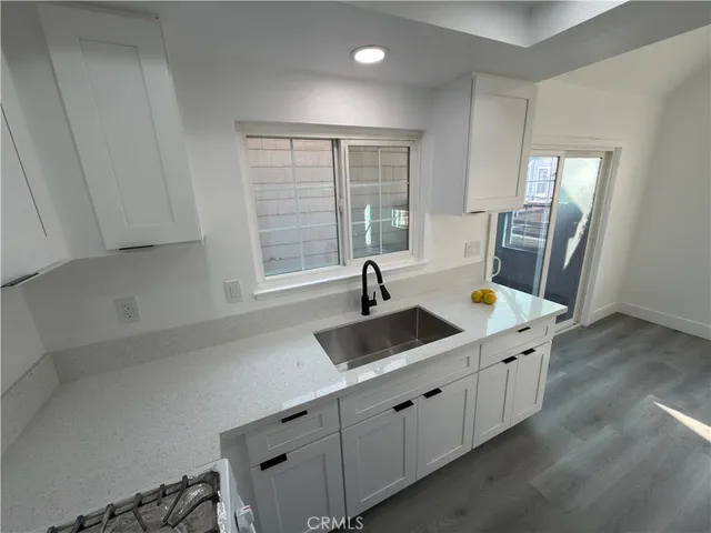 a kitchen with a sink and cabinets
