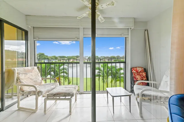 a view of a balcony with table and chairs with wooden floor
