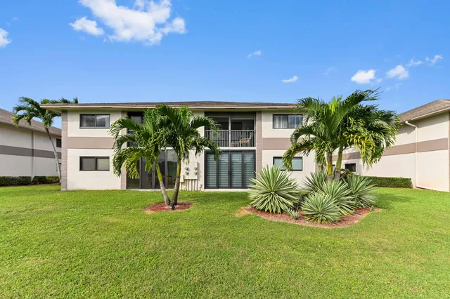 a house with a tree in front of it