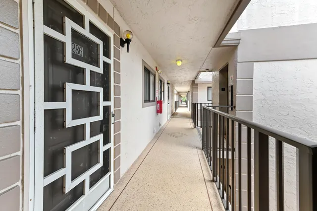a view of walk in closet with living room