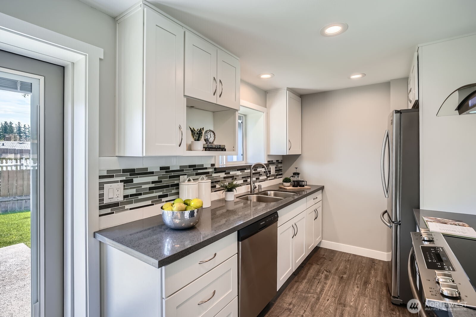 3501 Northeast 10th Street Renton, WA 98056 - Photo 11 of 28 a kitchen with a sink appliances and cabinets