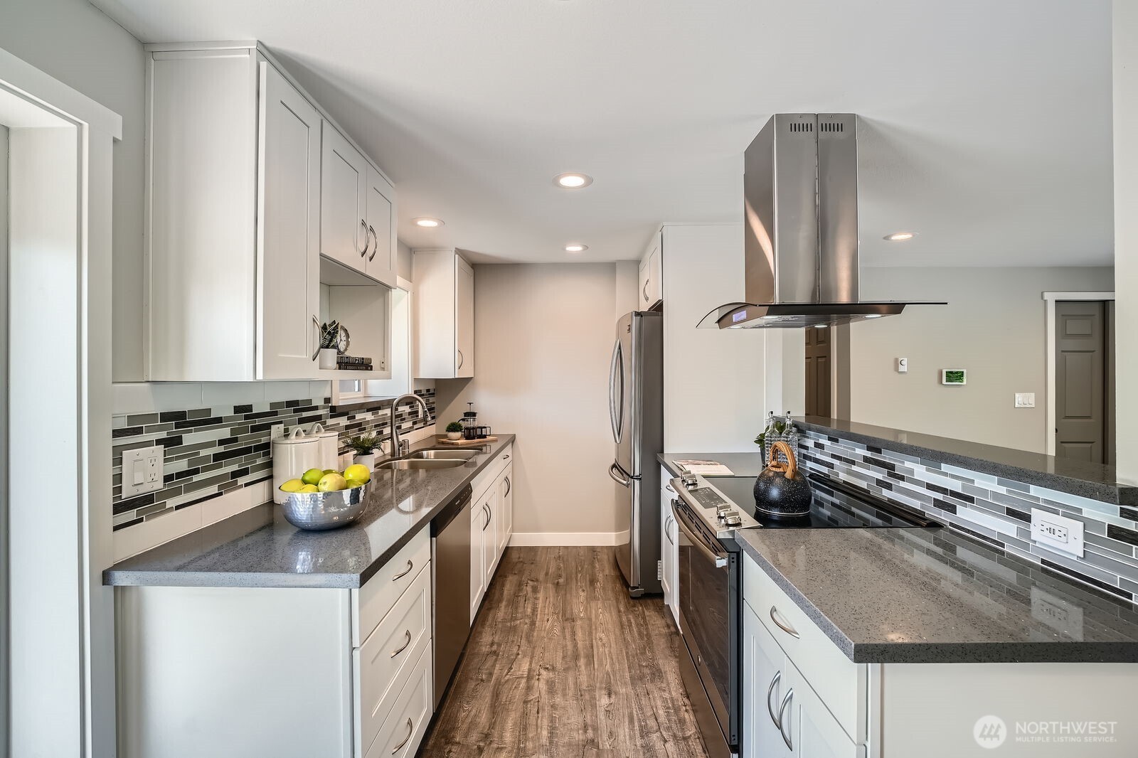 3501 Northeast 10th Street Renton, WA 98056 - Photo 15 of 28 a kitchen with a sink stove and refrigerator