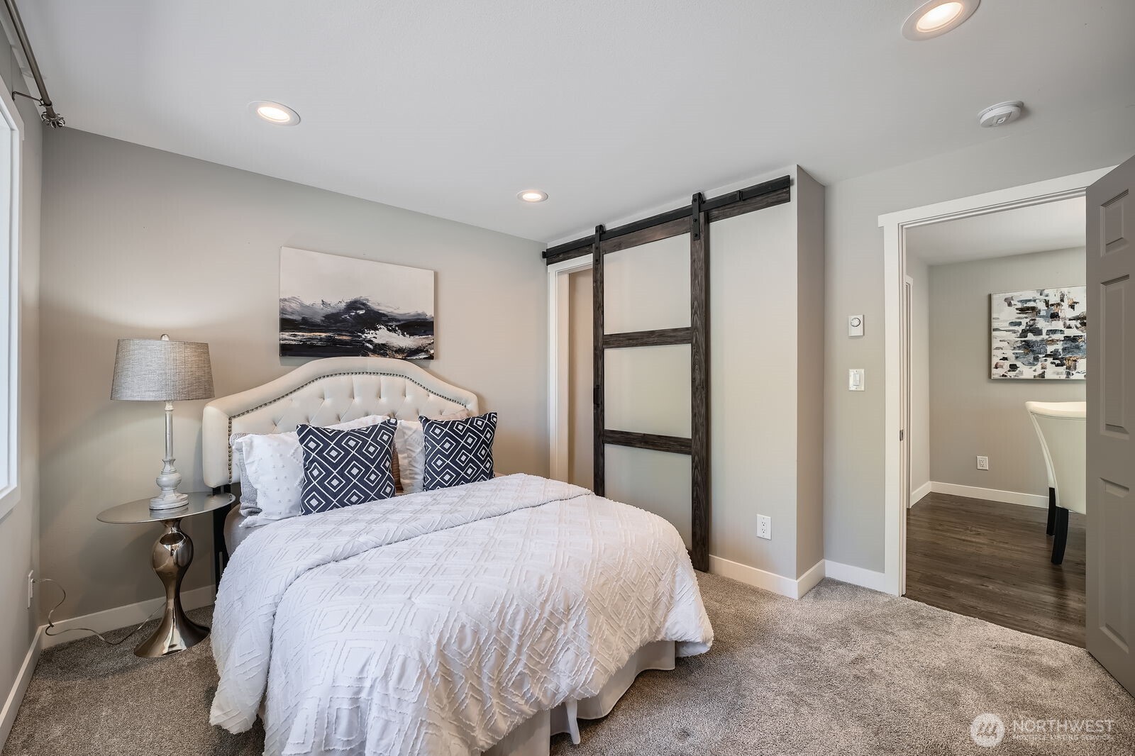 3501 Northeast 10th Street Renton, WA 98056 - Photo 17 of 28 a bedroom with a bed and a mirror