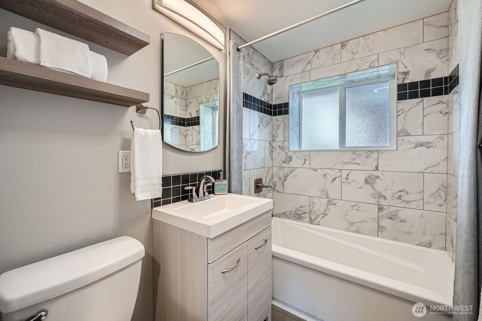 3501 Northeast 10th Street Renton, WA 98056 - Photo 18 of 28 a bathroom with a sink a toilet and shower