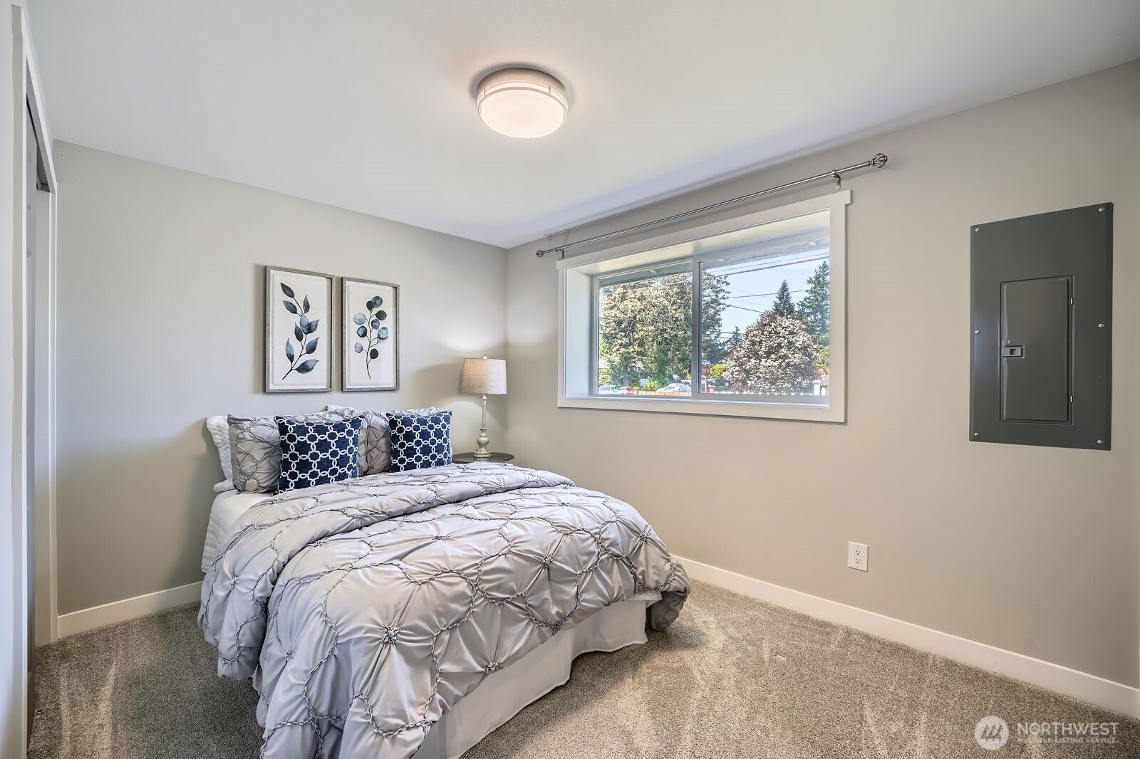 3501 Northeast 10th Street Renton, WA 98056 - Photo 20 of 28 a bedroom with a large bed and a window