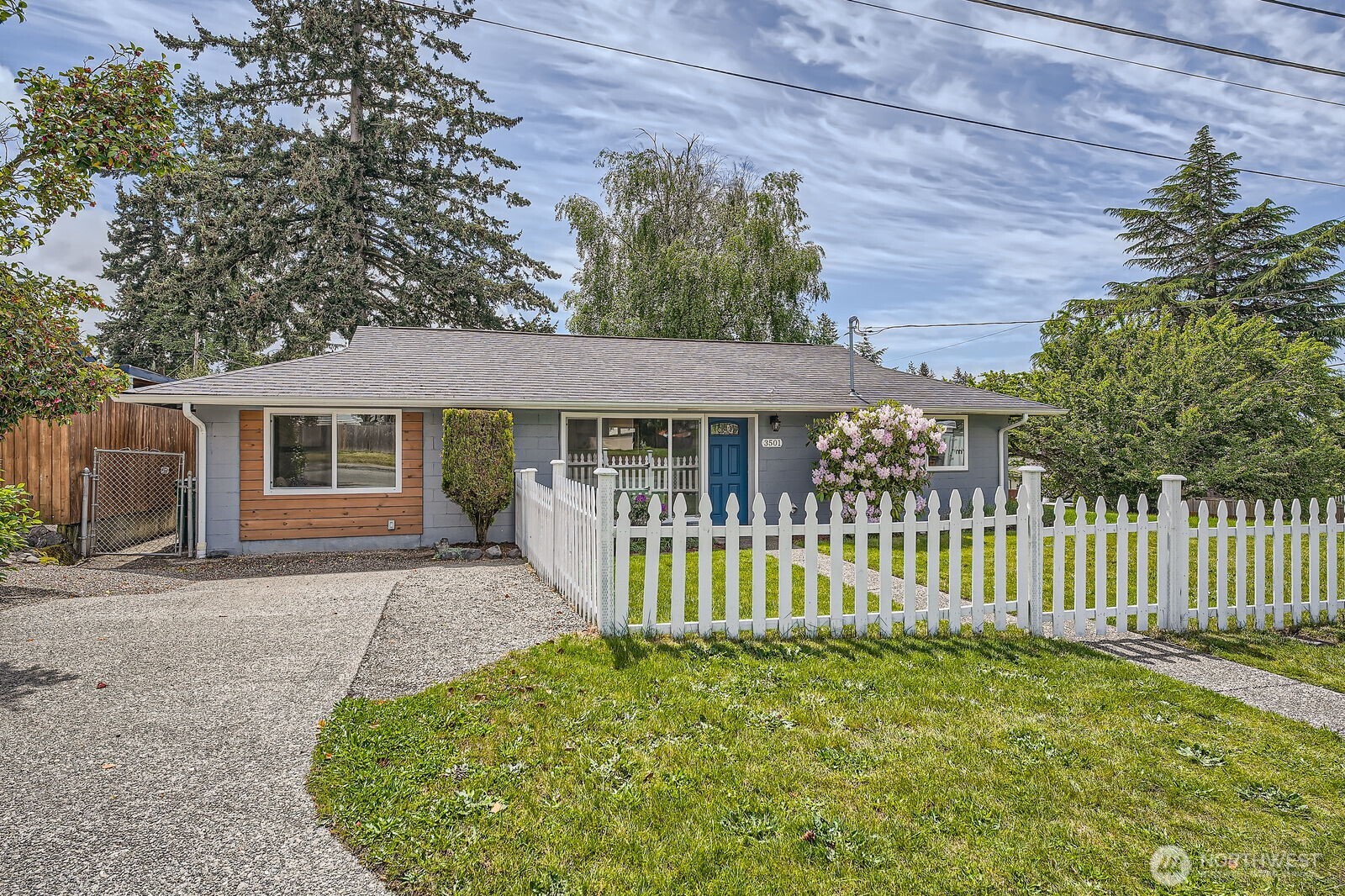 3501 Northeast 10th Street Renton, WA 98056 - Photo 2 of 28 a front view of a house with a garden