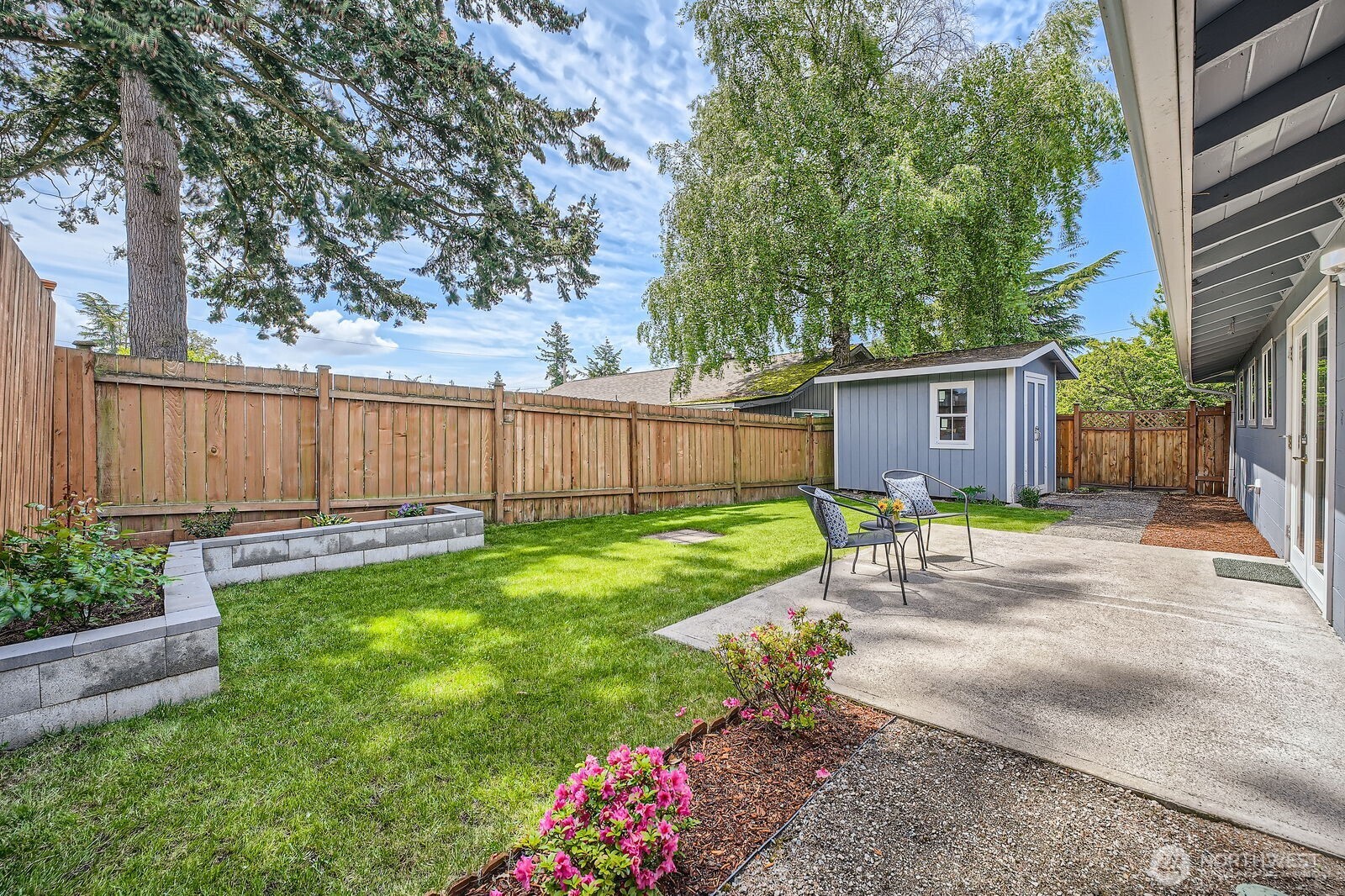 3501 Northeast 10th Street Renton, WA 98056 - Photo 25 of 28 a view of a backyard with a garden