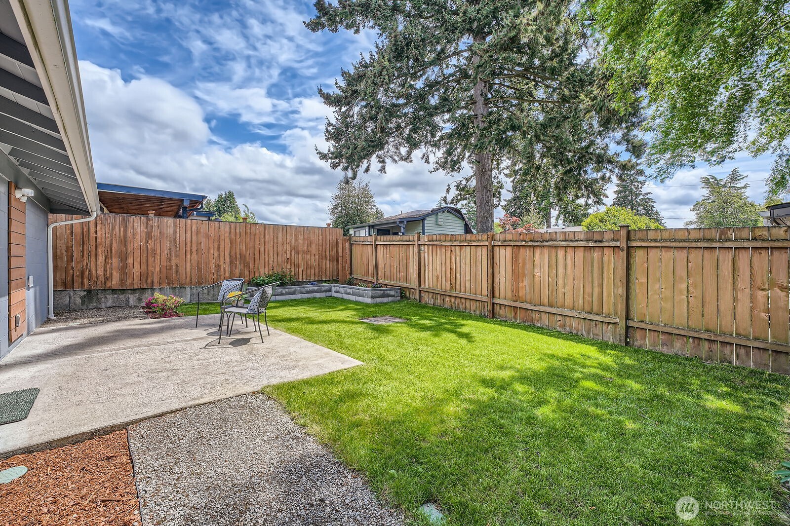 3501 Northeast 10th Street Renton, WA 98056 - Photo 26 of 28 a view of a backyard with wooden fence