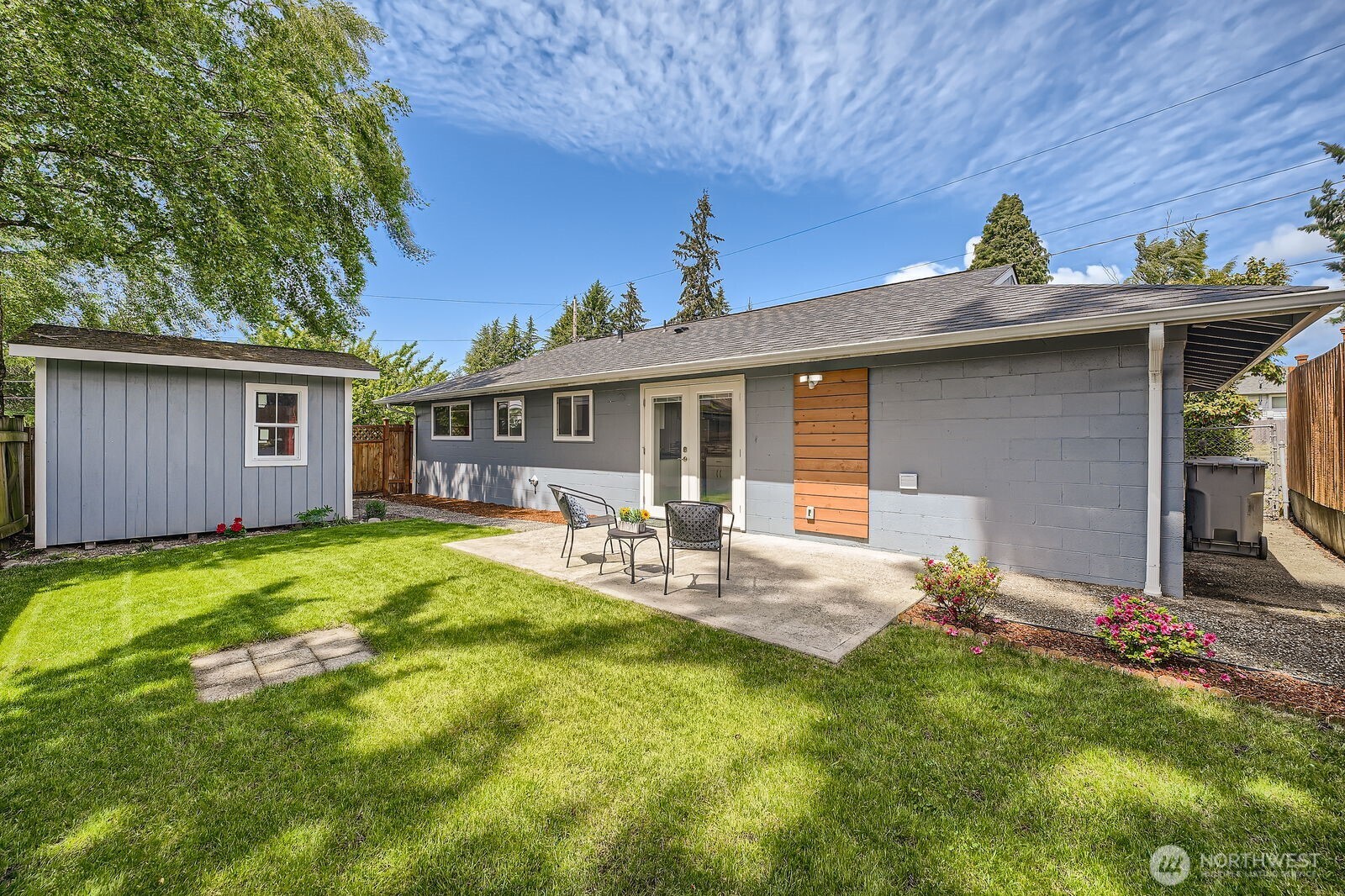 3501 Northeast 10th Street Renton, WA 98056 - Photo 27 of 28 a view of a house with backyard and sitting area