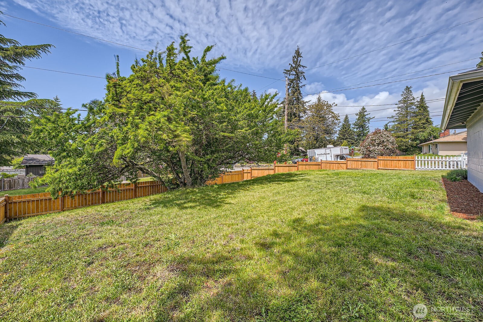 3501 Northeast 10th Street Renton, WA 98056 - Photo 28 of 28 a backyard of a house with lots of green space
