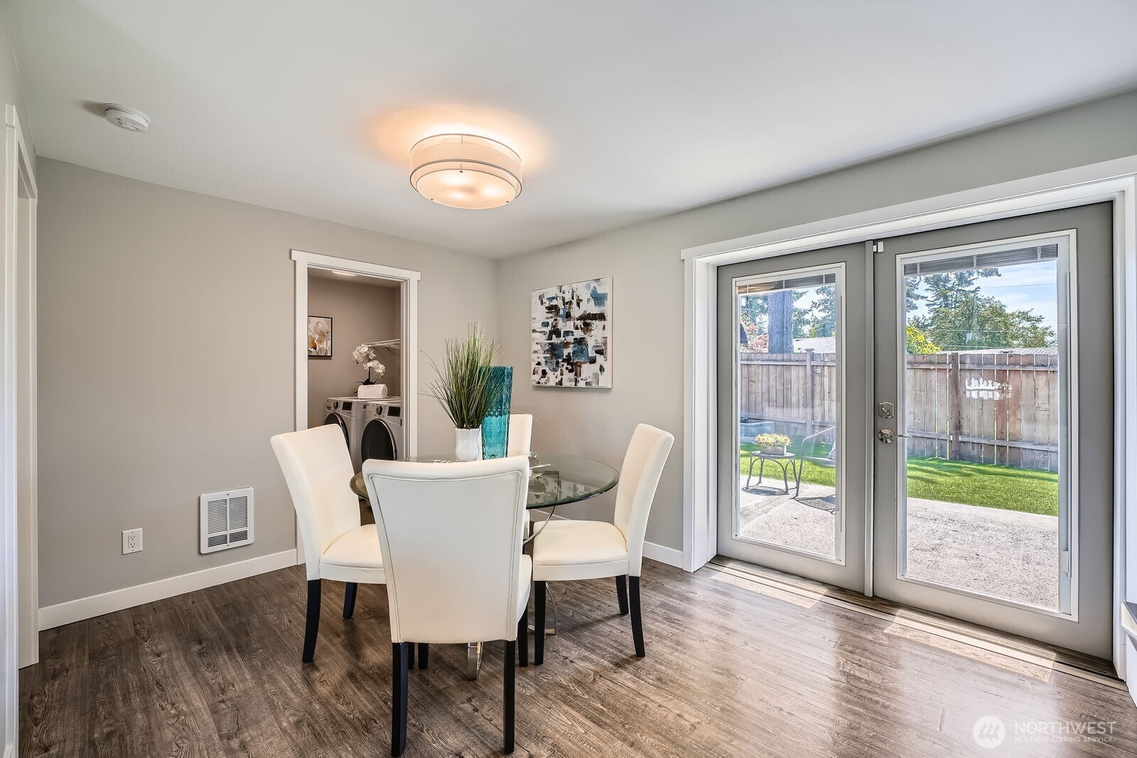 3501 Northeast 10th Street Renton, WA 98056 - Photo 8 of 28 a view of a dining room with furniture and wooden floor