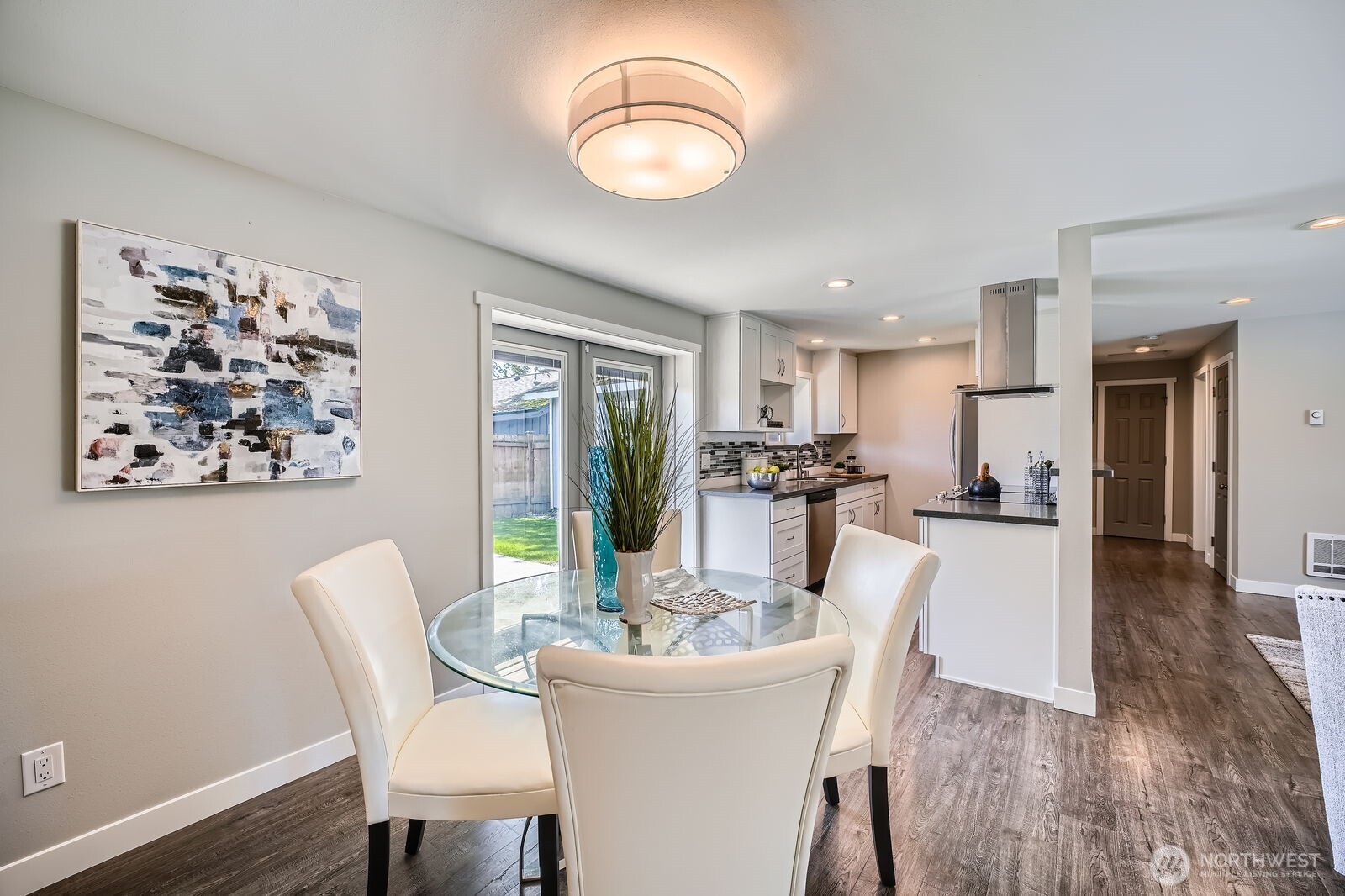 3501 Northeast 10th Street Renton, WA 98056 - Photo 10 of 28 a view of a dining room with furniture and wooden floor