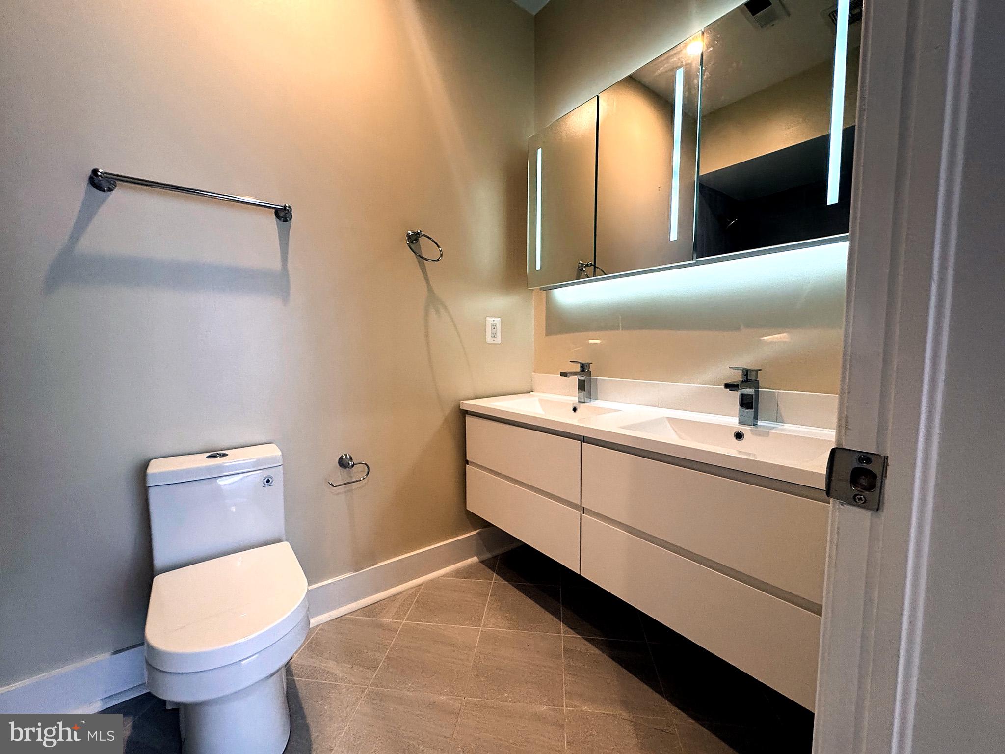 625 Park Road Northwest Washington, DC 20010 - Photo 19 of 22 Sleek modern bathroom with elegant finishes.