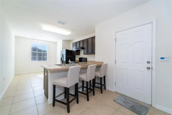 a view of a dining room with furniture and a livingroom
