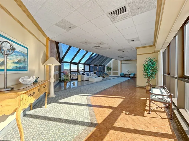 a view of a swimming pool with seating space