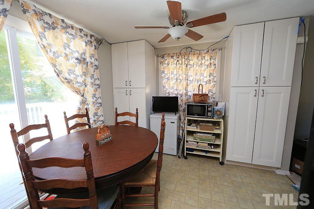 7705 Mourning Dove Road Raleigh, NC 27615 - Photo 3 of 14 a view of a dining room with furniture window and outside view