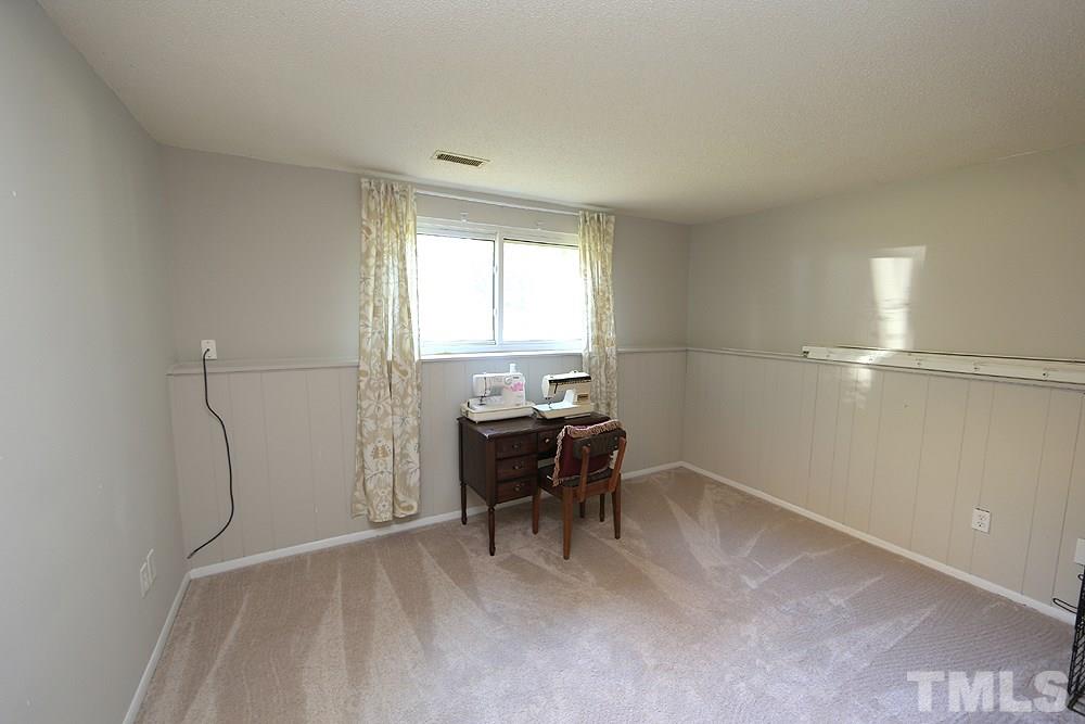 7705 Mourning Dove Road Raleigh, NC 27615 - Photo 7 of 14 a workspace with wooden floor and a window