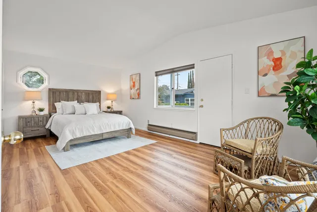 a bed room with a bed and a window