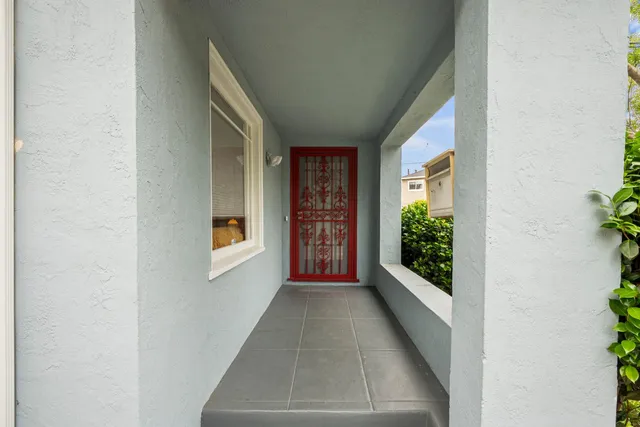 a view of a hallway with windows