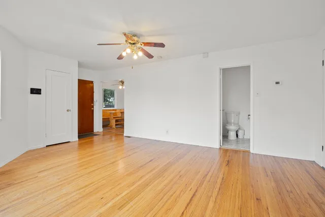 an outdoor space with pool table and chairs