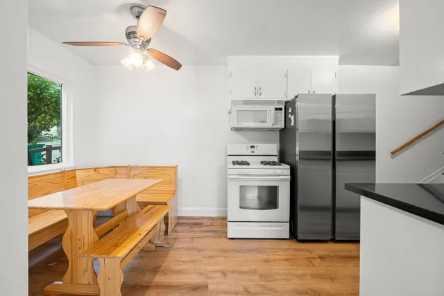 a kitchen with cabinets and stainless steel appliances