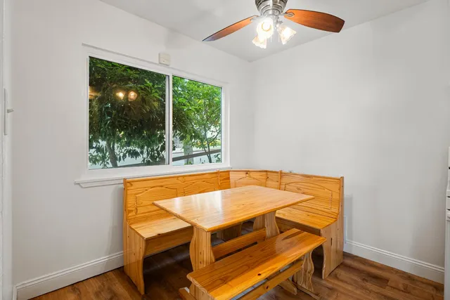 a kitchen with a sink a refrigerator and cabinets