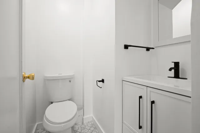 a bathroom with a sink a mirror and a shower