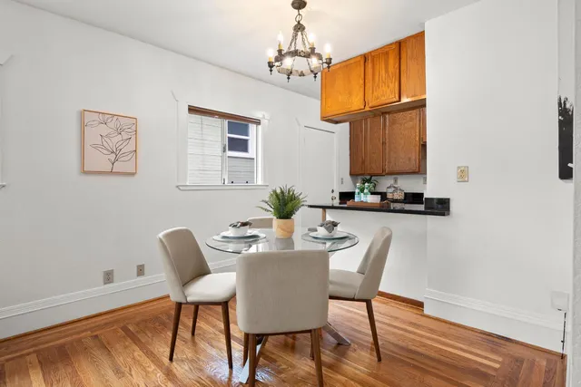 a dining room with furniture and window